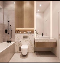 a bathroom with a toilet, sink and bathtub next to a wall mounted shower head