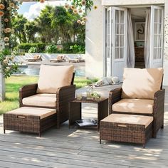 two chairs and a table on a wooden deck