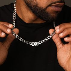 Men's Cuban Link Chain has been expertly designed and crafted to achieve the ideal length, weight, and shine while also providing a comfortable fit for everyday wear. The necklace comes with a distinctive black diamond charm. This striking detail adds a touch of sophistication and luxury to an already exceptional accessory. Personalize it with your own unique touch by adding a special date, the names or initials of your loved ones, and create a truly one-of-a-kind piece of jewelry. Birthstone Earrings Studs, Silver Cuban Link Chain, Stainless Steel Bracelet Men, Mens Silver Necklace, Classic Bracelets, Classic Necklace, Engraved Bracelet, Solid Gold Jewelry, Name Bracelet