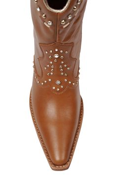 Polished studs and sparkling crystals put a contemporary spin on this stacked-heel Western boot. Leather upper/synthetic lining/leather sole Imported Studded Leather Boots With Pointed Toe, Studded Leather Moto Boots With Pointed Toe, Leather Moto Boots With Spikes And Pointed Toe, Spiked Leather Moto Boots With Pointed Toe, Studded Round Toe Calf Leather Boots, Studded Leather Boots With Snip Toe, Leather Boots With Rhinestones For Fall, Western Leather Boots With Studded Rubber Outsoles, Western Pointed Toe Boots With Rhinestone Rivets