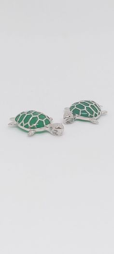 GREEN Jade TURTLE Pendant in 925 Silver. Jade Turtle Pendant. Lucky Turtle Pendant ONLY or W/16 -2 Inches Silver over white Rhodium-plated chain Extended. Product Info: -Pendant Jade Turtle: 26mm x 18mm. -Metal: 925 Silver. -Finish: Silver. -Stone: Green Jade. -Stone Color: Green. -Chain Length: 16 -2 Inches Extended. -Nice Gift box is included Handmade Turtle-shaped Sterling Silver Jewelry, Turtle Pendant, Jade Stone, Green Jade, Jade Green, Gold Trim, Chain Lengths, Rhodium Plated, Stone Color