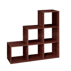 a set of four wooden cube shelves against a white background