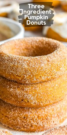 three ingredient pumpkin donuts stacked on top of each other with the title above it