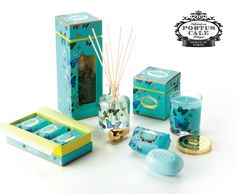 an advertisement with candles, soaps and other items in blue boxes on a white background