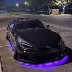 a black car with purple lights on it