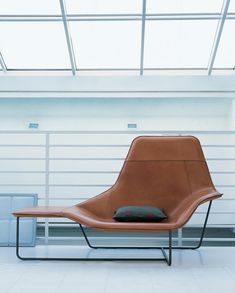 a chair sitting in front of a garage door