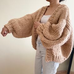 Super soft and comfortable to wear. Made of pure wool 5WP, 1,200-1,300 grams Please feel free to message me for your own custom color and size. Size: Width 29 Inches           Length 21 Inches P.s. Model wearing cardigan is 5'3 / 104 lbs. Made to order takes 1-2 week to knit and shipping. Do not hang, fold and store. Dry clean. Or spot cleaning only dirty area. Or Hand wash only in cold or lukewarm water. Use a delicates hand wash detergent / Give your knits a gentle squeeze and leave in the water for a few minutes / Once done, roll in a clean towel to remove excess water and then dry flat Chunky Knit Sweater Pattern, Autumn Cardigan, Simple Style Outfits, Knit Wear, Color Sweater, Chunky Cardigan, Chunky Knit Cardigan, Cardigan Outfits, Sweater Knitting Patterns