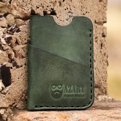 Marked with the artisan's brand to distinguish it as a high-quality example of Armenia's crafts, this leather card holder comes to add convenience and sophistication to your days. Armen Tovmasyan uses traditional techniques to create the accessory's handy structure, which features a front compartment and a generous open-top pocket. In addition, its green hue adds a touch of freshness. Gift Suggestions, Leather Card Holder, Premium Gift, Free Gift Wrapping, Handcrafted Leather, Card Holder Leather, Armenia, Open Top, School Crafts