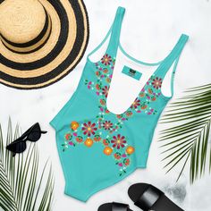 This one-piece swimsuit for all figures will bring out your best features. Enjoy the smooth fabric and the flattering design, and show it off by the sea or pool! • 82% Polyester, 18% Spandex • Fabric weight: 6.78 oz/yd² (230 g/m²), weight may vary by 5% • Chlorine-resistant fabric • Cheeky fit with a scoop neckline and a low scoop back • Zig-zag stitching • Double-layer front • Four-way stretch material stretches and recovers on the cross and lengthwise grainsSize guide CHEST (inches) WAIST (inches) HIPS (inches) XS 33 ⅛ 25 ¼ 35 ⅜ S 34 ⅝ 26 ¾ 37 M 36 ¼ 28 ⅜ 38 ⅝ L 37 ¾ 29 ⅞ 40 ⅛ XL 41 33 ⅛ 43 ¼ 2XL 44 ⅛ 36 ¼ 46 ½ 3XL 47 ¼ 39 ⅜ 49 ⅝ Floral One Piece, Floral One Piece Swimsuit, Swimsuits For All, By The Sea, The Cross, Spandex Fabric, Zig Zag, Scoop Neckline, Double Layer