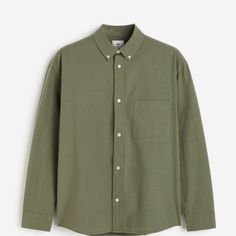 Elevate Your Wardrobe With This Stylish And Comfortable Men's Shirt From The Renowned Brand H&M. This Button-Up Shirt Features A Collared Neckline, Long Sleeves, And A Solid Pattern In Khaki Green Color, Perfect For Any Occasion. The Shirt Is Made Of Breathable Cotton Material That Keeps You Comfortable Throughout The Day. Additionally, The Shirt Showcases An Embroidered Accent With Button Closures And A Slimming Fit, Making It A Perfect Addition To Your Casual Or Formal Wear Collection. This Re H&m Summer Shirt For Everyday Wear, Green Cotton Shirt For Business Casual, Green Cotton Business Casual Shirt, Khaki Casual Top For Business Casual, H&m Relaxed Fit Shirt With Buttons, Green Relaxed Fit Shirt For Business Casual, Classic Button-up H&m Tops, H&m Relaxed Fit Shirt With Button Closure, Classic Button-up Tops By H&m