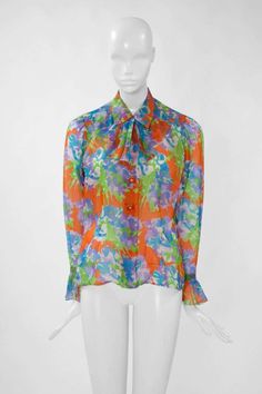 For Sale on 1stdibs - Based on the 1993 YSL Spring-Summer haute couture collection, this bright floral printed blouse is a genuine ode to the Spring. Cut in organdy silk, this Formal Multicolor Summer Tops, Multicolor Formal Tops For Summer, Multicolor Print Silk Blouse For Spring, Spring Multicolor Silk Blouse, Vintage Silk Blouse For Summer, Designer Multicolor Floral Print Blouse, Vintage Silk Summer Blouse, Vintage Silk Blouse With Floral Print, Vintage Multicolor Silk Tops