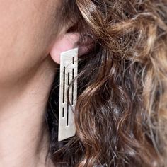 These edgy long stud earrings are made of 925 sterling silver and have a brushed, matte finish. They are a unique pair of geometric drop earrings, with a modernist design, inspired by nature. They trully make a bold statement, and can be a great addition to your jewelry collection or the perfect gift for someone you love.  ► Measurements - Lenght: 2.36'' / 6.0cm - Max Width: 0.47''/ 1.2cm - Metal thickness: 0.032''/ 0,8mm ► Allow slight differences in each piece. This is part of what makes your piece unique! ► Looking for a different color or other stud & drop earrings?  - Gold plated:  www.etsy.com/listing/1218025830/gold-long-stud-earrings-edgy-sterling?click_key=1096bde8ab81d3d32c47ab53189fc30efc158f23%3A1218025830&click_sum=d6947d03&ref=shop_home_active_3&frs=1 - Other stud & drop earr Modern Long Drop Linear Earrings As Gift, Modern Geometric Linear Earrings For Gifts, Modern Silver Linear Pierced Earrings, Modern Silver Linear Earrings As Gift, Modern Sterling Silver Linear Earrings As Gift, Contemporary Linear Earrings For Gifts, Modernist Design, Unique Gifts For Women, Jewelry Unique