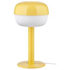 a yellow table lamp with a white light on it