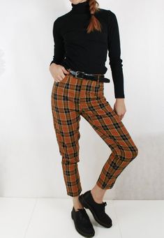 Fully lined check tartan patterned tapered Mom jean style chino/Capri pants in navy and chestnut brown colourway. Other colours available in our shop (see final photo). - Flattering high rise at the waist and narrow at the ankle - Two pockets - Belt loops - Fully lined Outer material is 100% cotton and looks great paired with Doc Martens and a navy ribbed turtle neck. Sizing: Sizes UK 6, 8, 10, 12, 14, 16, 18, 20 & 22 available, please see the last photo for sizing chart. Condition: New. Pos Colored Pants Outfits, Mom Jeans Style, Tartan Pants, Plaid Trousers, Country Fashion, Mom Jean, Chestnut Brown, Colored Pants, Plaid Pants