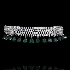 A captivating ensemble expertly crafted to effortlessly elevate your style! Crafted with precision, this choker set boasts with stunning CZ stone work that is perfectly complemented by emerald green dangling stones - adding a touch of allure, making it the perfect choice for any occasion. The set includes a choker and a pair of straight-drop earrings. Approximate earrings length is 1.5". Silver-plated on high-quality brass as base metal. Made by order. Kindly allow 5-7 weeks for the delivery of Green Choker Bridal Necklace For Formal Occasions, Elegant Green Choker For Reception, Unique Gift Cards, Choker Set, Create Words, Faux Stone, Stone Work, Cz Stone, Elevate Your Style