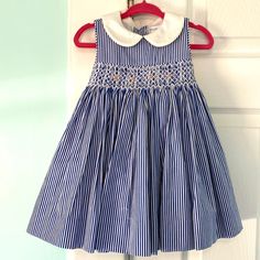 Beautiful Blue And White Striped Dress. Smocking With Precious Floral Embroidery. Buttons Down The Back With A Bow. Fully Lined. New With Tags! Reasonable Offers Considered. No Trades. Blue Embroidered Cotton Smocked Dress, Cute Ruffled Ralph Lauren Dresses, Cute Ralph Lauren Dress With Ruffles, Cute White Ralph Lauren Dress, Cute Blue Dress With Smocked Back, Embroidery Buttons, Blue And White Striped Dress, Ralph Lauren Baby Girl, Kid Clothes