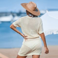 Looking for a relaxed beach vibe? The Apricot Drop Shoulder Open Knit Mini Cover-Up is perfect for sunny days. With its drop shoulder design and open knit fabric, this mini cover-up provides a breezy, laid-back fit. Wear it as a stylish cover-up over your swimsuit or pair it with sandals and accessories for a fashionable beachside ensemble that will turn heads wherever you go. Product code: CAA07C4F005KK Beige V-neck Beach Dress For Vacation, Beige V-neck Cover-up For Vacation, White Cover-up For Beach Season, Lightweight Cover-up For Beach Season, Casual Beach Cover-up For Resort Season, Beachwear Cover-up For Vacation, Vacation Beachwear Cover-up, Vacation Beachwear Cover-up For Warm Weather, Breezy Beach Dress With Short Sleeves