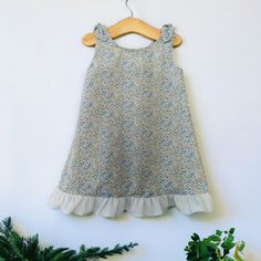 This cute little dress is a classic design that will look adorable on your little one,made in Liberty fabrics with bow detail on shoulder. AGE.        Chest.      Waist.        Hip  1.                20.            19.5.          -  2.                21.              20.           -  3                 22             20.5.         -  4.                23.              21.           24  5.                24.            21.5.          25  6.                25.              22.           26 Spring Playtime Dress With Bow, Playful Sleeveless Dress With Bow, Cotton Dress With Bow Tie Back For Garden Party, Spring Sleeveless Dress With Bow For Dress-up, Cotton Sleeveless Ruffled Dress For Garden Party, Cute Cotton Dress With Bow Tie Back, Cotton Sleeveless Dress With Ruffles For Garden Party, Cute Ruffle Dress For Garden Party, Spring Playtime Dress With Ruffled Straps