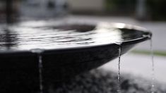 a fountain with water running down it's sides