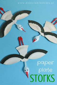 paper plate storks are flying in the sky