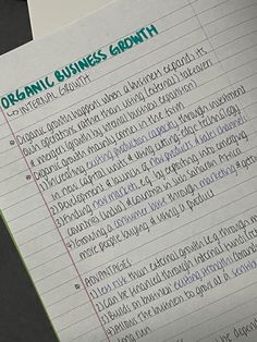 a piece of paper that has writing on it with the words organic business growth written in cursive writing