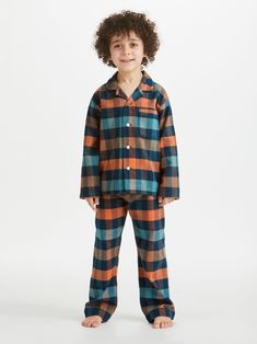 Ease them into their sleep routine with the seasonal Kelburn 40 kids' unisex pyjama set in a check with our season tones: desert, sand and terracotta. Crafted to keep them looking their best, whether it be for winding down before bed or for breakfast around the table in the morning - we've kept things simple for our kids' pyjamas, with a smart, rounded collar with revers, one breast pocket and plain hems on the sleeves. The pyjama top is fastened with buttons and piped in complementary navy, whi Starlight Express, Kids Pyjamas, Boys Pjs, Boys Night, Unisex Pajamas, Kids Nightwear, Kids Pjs, Sleep Routine, Night Suit