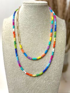 22" colorful necklace Each necklace sold separately Disclaimer: colors could vary slightly from photos Vibrant Rainbow Jewelry With Colorful Design, Colorful Adjustable Multi-strand Jewelry, Multi-strand Necklaces With Lobster Clasp For Gifts, Adjustable Multicolor Beaded Charm Necklaces, Long Single Strand Costume Jewelry Necklace, Adjustable Rainbow Round Bead Necklaces, Adjustable Rainbow Necklace With Colorful Beads, Rainbow Round Bead Adjustable Necklace, Adjustable Double Strand Layered Necklace With Colorful Beads