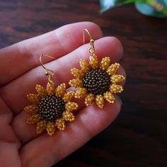 Two small and dainty sunflowers, hand beaded using hundreds of super-tiny glass beads, strung and stitched one at a time. Mini sunflowers measure just over 1 inch (28mm) each. Total length of earrings with ear wires: 1.5 inches (40mm.) © 2020-2021 Heart in Hawaii Available in larger size; sold separately Matching brooch available; sold separately Professionally handmade in the US Truly unique; exclusive design; direct from the artist Gift wrapping and 1st Class US shipping included Yellow Beaded Earrings With Czech Glass, Yellow Beaded Czech Glass Earrings, Yellow Round Sunflower Jewelry, Gift Gold Beaded Earrings, Bohemian Sunflower Design Jewelry With Round Beads, Handmade Gold Flower Earrings With Czech Glass, Gold Czech Glass Flower Jewelry, Gold Czech Glass Flower Shaped Jewelry, Beaded Flower Earrings Gift