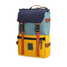 a blue and yellow backpack sitting on top of a white floor