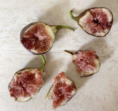 four figs cut in half on a table