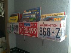 several license plates are hanging on the wall