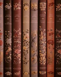 a row of old books with floral designs on them