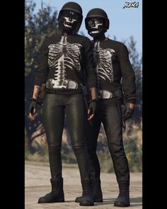 two people in skeleton shirts and helmets standing next to each other