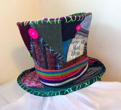 a colorful hat sitting on top of a bed