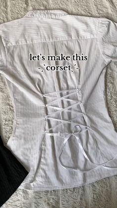 a white shirt with the words let's make this corset