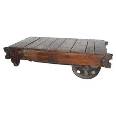 an old wooden cart with wheels on it