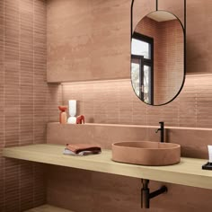 a bathroom with a sink, mirror and counter top in it's center area