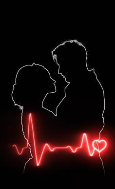 a man and woman kissing in front of a heartbeat