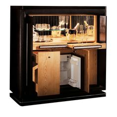 an open cabinet with wine glasses and bottles in it