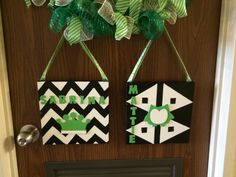 the door is decorated with green and white decorations