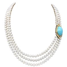 Very elegant opera necklace: thee stands of white peals closing with a yellow gold clasp which is also the adornment of this piece. It consists of a 27mm long turquoise set in yellow gold and surrounded with approximately 2.2 carats of top quality diamonds. The clasp measure 41mm - 1.61in / 23mm -91in Matches the earrings ref: LU47232268313 Elegant Single Strand Turquoise Jewelry, Elegant Turquoise Necklace With Round Beads, Elegant Turquoise Single Strand Jewelry, Elegant Turquoise Pearl Necklace With Gemstone, Elegant Yellow Gold Turquoise Necklace With Cabochon, Elegant Yellow Gold Turquoise Cabochon Necklace, Elegant Single Strand Turquoise Necklace, Elegant Turquoise Pearl Necklace With Round Beads, Elegant Turquoise Gemstone Necklace With Round Beads