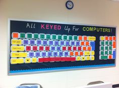 a bulletin board with colorful keys on it in an office setting for students to use