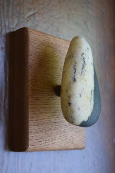 a close up of a rock mounted on a wall