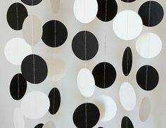 black and white paper circles hanging from the ceiling