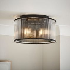 a light fixture hanging from the ceiling in a room