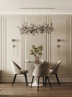 an elegant dining room with white walls and wooden floors