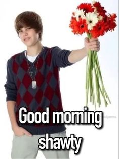 a young man holding flowers with the caption good morning shawty