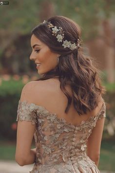 a woman wearing a dress with flowers in her hair