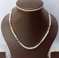 Natural Fresh Water Pearls Necklace Mala Fancy Multi Mala Beads Gemstone 16'' Inch 75 Carat AAA Quality Gemstone Necklace Stone : Natural Fresh Water Pearls Shape :- Round Size - 4x4 - 5x5mm 75 carat 16'' inch Necklace Polish :- Handmade Purity :- AAA color - White Red Green makes a great gift for your loved ones. It is known as the 'love stone' as the message it emits is the strong vibration of unconditional love, joy, warmth and healing. As quartz crystals are profound amplifiers of energy, it White Gemstone Necklaces With Round Beads, Pearl White Necklace With Round Gemstone Beads, White Polished Beads Gems And Cabochons For Gifts, Festive Multicolor Pearl Necklaces, White Stone Necklace For Festive Occasions, Elegant Multicolor Pearl Beads, Traditional Pearl White Necklaces With Round Beads, Festive Beaded Necklaces With Round Stones, Festive Round Beads Necklace With Stones