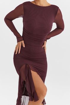 Features: Introducing our Elegant Ruffle Ruched Midi Dress, crafted for the fashionable and bold woman. Embrace your curves with this sheer, backless beauty featuring long sleeves and an irregular hem. Perfect for club parties and special occasions. Expertly designed with ruffles and ruching for a stunning silhouette. Midi Dress Elegant, Ruffle Midi Dress, Women's Robe, Ruched Midi Dress, Backless Design, Irregular Hem, Club Parties, Mesh Long Sleeve, Bodycon Midi